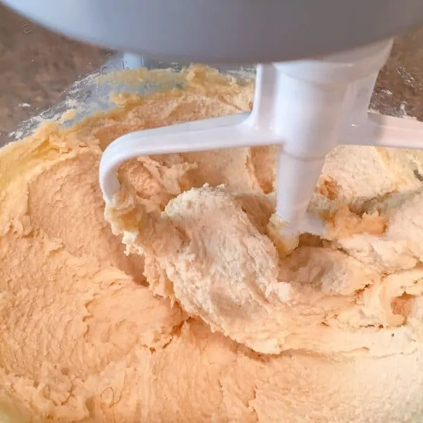 creaming together butter, sugar, and brown sugar for snickerdoodle cookies