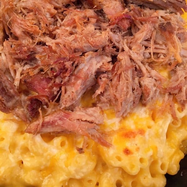 close up of baked leftover BBQ pulled pork macaroni and cheese