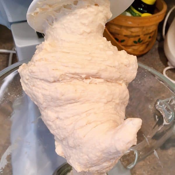 French bread dough clinging to dough hook