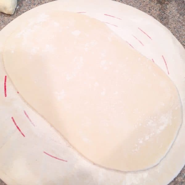 Bread dough rolled out into a large rectangle