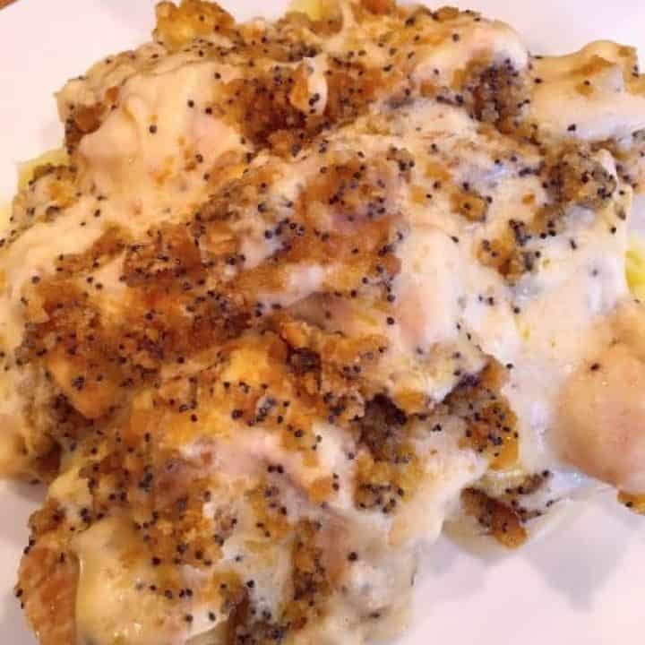 Plate full of Poppyseed chicken on mashed potatoes