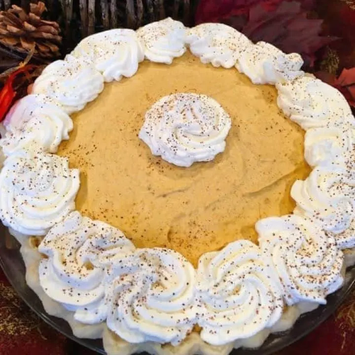 Overhead shot of Pumpkin Chiffon Pie with Whipped cream.