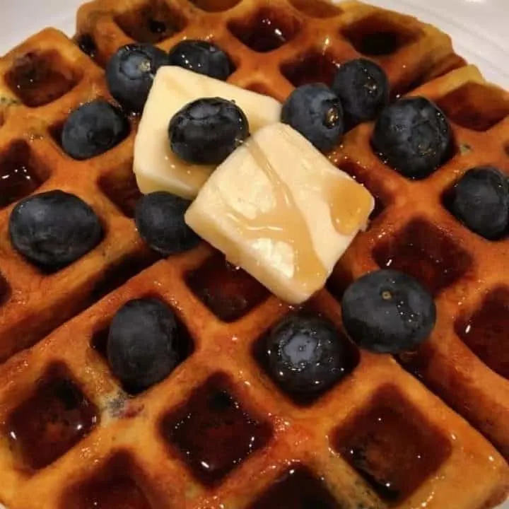 Blueberry Banana Belgian Waffles with butter and syrup
