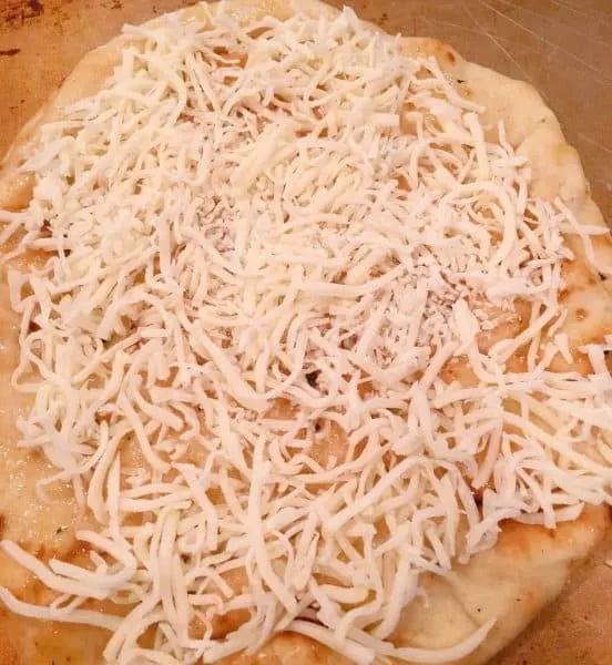cheese on top of each Naan crust 