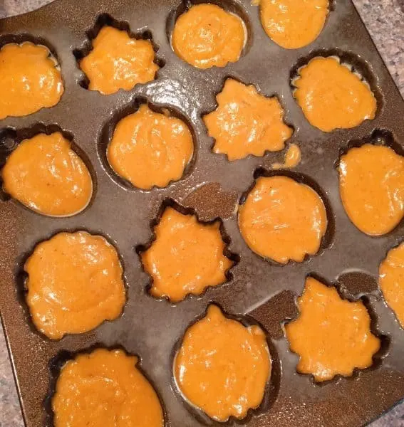 Nordic Ware Muffin pan with bread batter in the pan