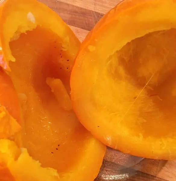 Pumpkin cooked and cooling on a cutting board