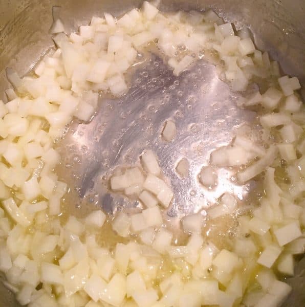 Onions cooking in bottom of Instant Pot 