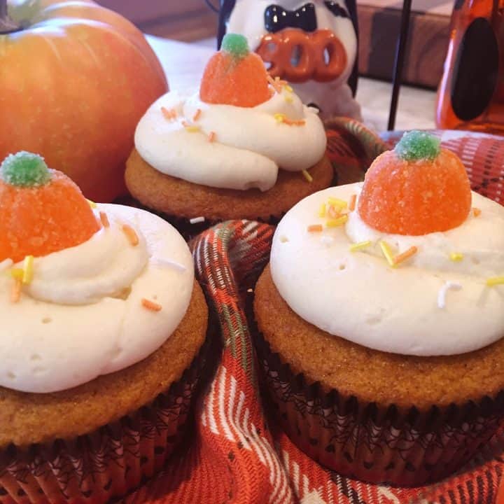 Pumpkin cupcakes with cream cheese frosting and gummy sugar pumpkins