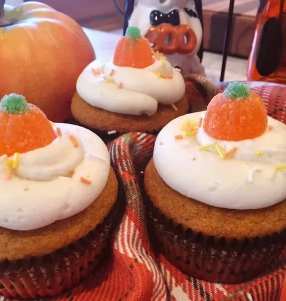 Pumpkin cupcakes with cream cheese frosting and gummy sugar pumpkins