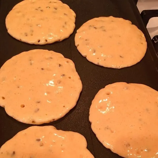 Pancakes poured onto a hot griddle