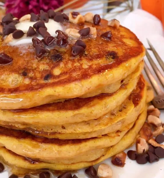 Stack of Pumpkin Chocolate Chip Pancakes with syrup