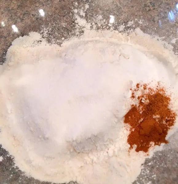 Flour, sugar, baking soda, spices in a large mixing bowl.
