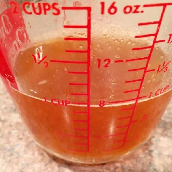 Reduced Apple Cider in measuring cup