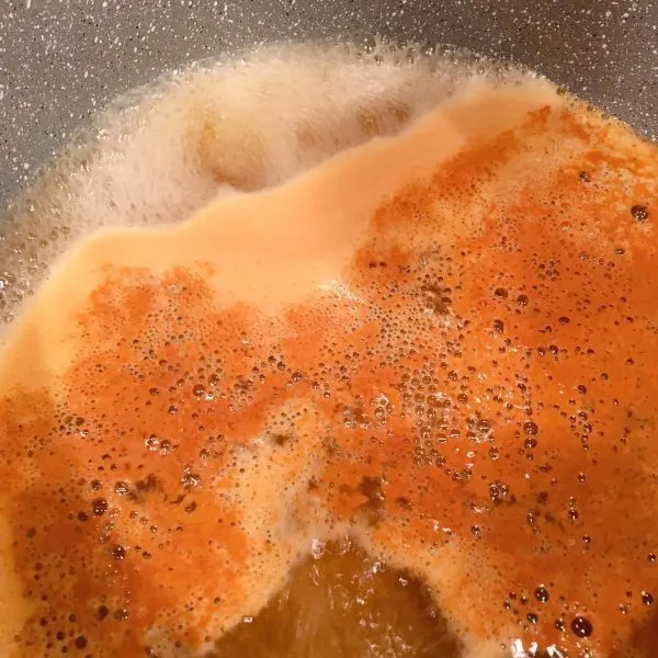 Apple cider boiling in the pan