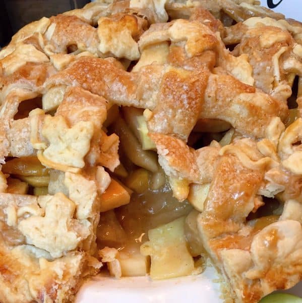 Spiced Caramel Apple Pie with slice out of the center