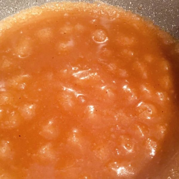 Caramel sauce boiling in sauce pan
