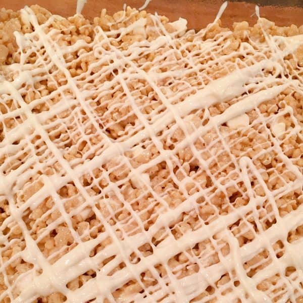 White chocolate drizzled over the top of rice krispie treats