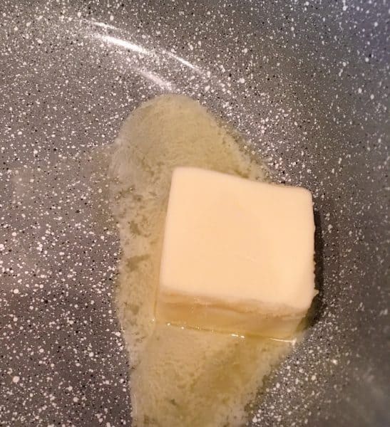 Butter melting in a sauce pan.