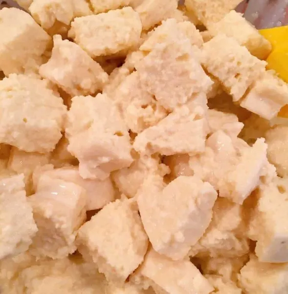 Bread cubes soaking up egg mixture