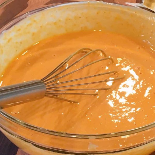 Pumpkin Puree and eggs mixed together in large bowl