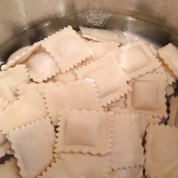 Pot with water and cheese Ravioli