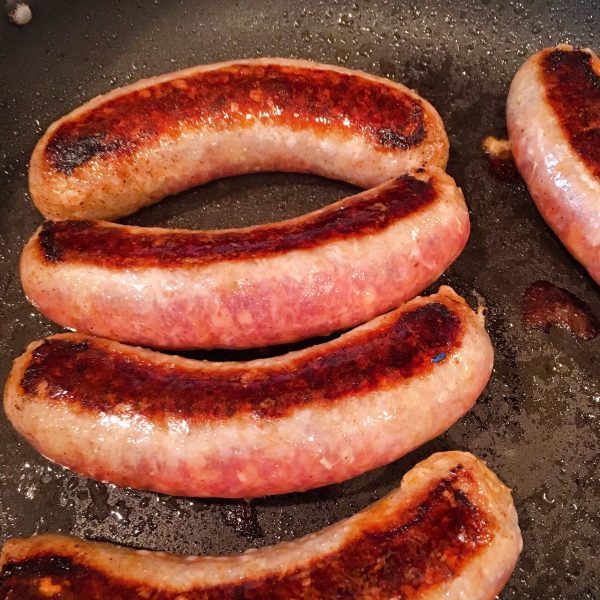 Italian Sausage browning in the skillet.