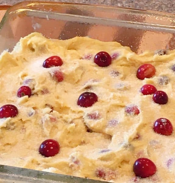 Adding the cranberries to the top of the cake