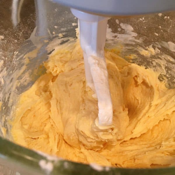 Adding flour and baking soda to butter sugar mixture