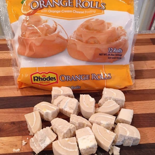 a 36.5 ounce package of Rhodes Orange Rolls cut into fourths.
