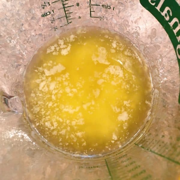 Melted butter in measuring cup