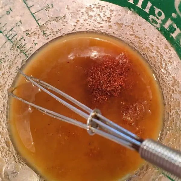 Adding brown sugar and spices to melted butter