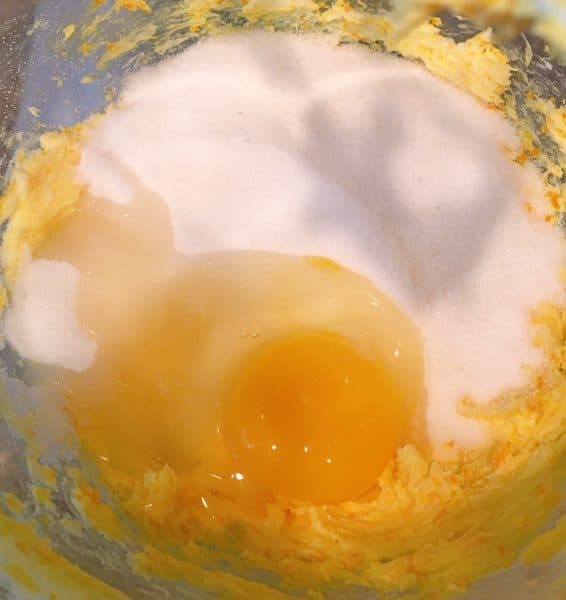 Adding sugar and egg to butter mixture