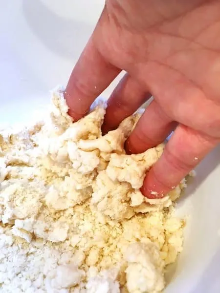 Finger raking the dough
