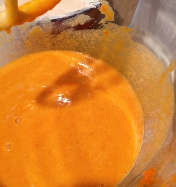 Adding canned pumpkin to cake batter