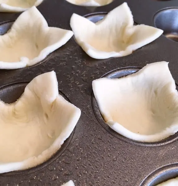 Puff pastry squares in mini tin baking pan