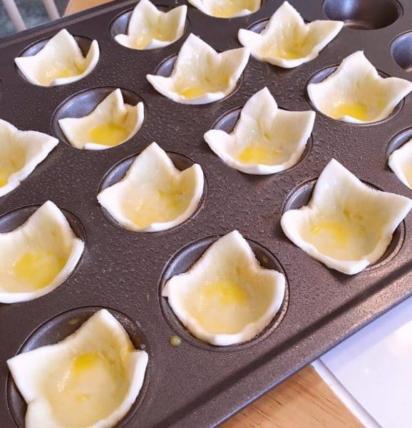 puff pastry squares brushed with egg was ready for baking