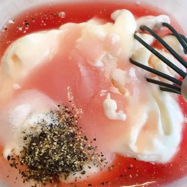 Dressing ingredients in a bowl for salad dressing