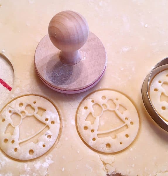 Shortbread dough rolled out and cookies being cut out.