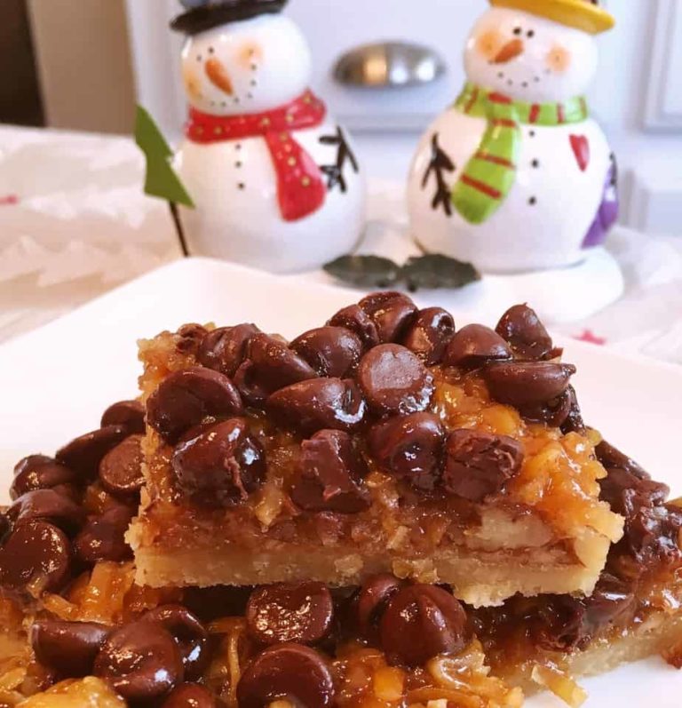 Easy Chocolate Caramel-Pecan Bars stacked on a plate.