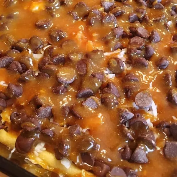 Caramel topping poured over chocolate chips