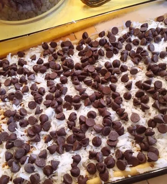 Chocolate Chips on top of coconuts and pecans