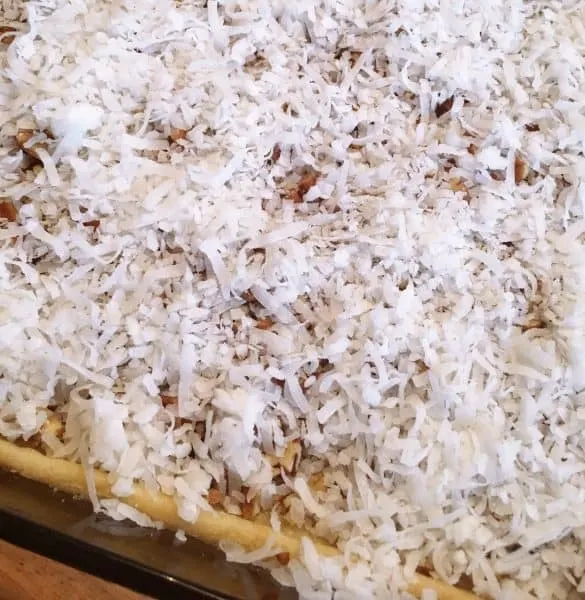 Pecans and Coconut on crust in baking dish