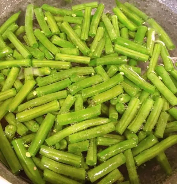 cut green beans in boiling water