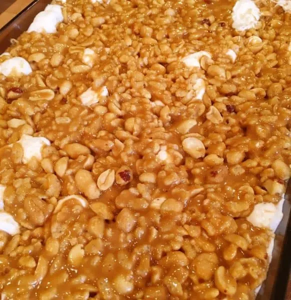 Chewy peanut topping spooned over marshmallows