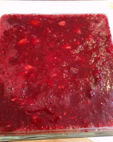 Placing Jello in dish to set up in refrigerator