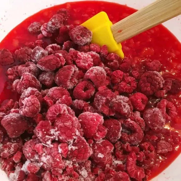 Frozen Raspberries being added to gelatin