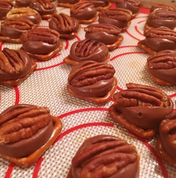 Top each rolo with pecan half 