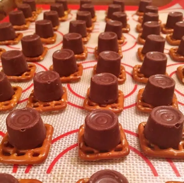 chocolate caramel candies on top of pretzels