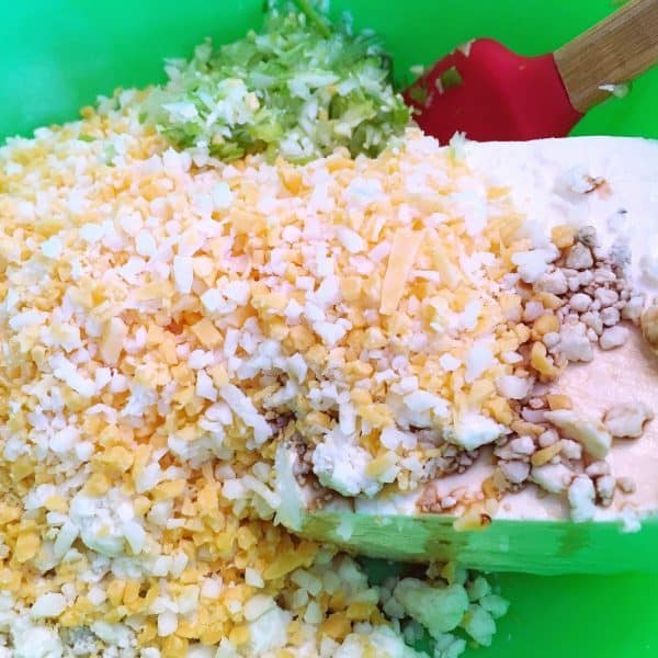 cream cheese, blue cheese, and more in a bowl for blue cheese balls