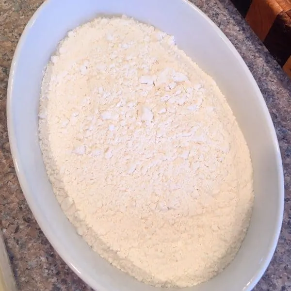 flour in a shallow baking dish or bowl
